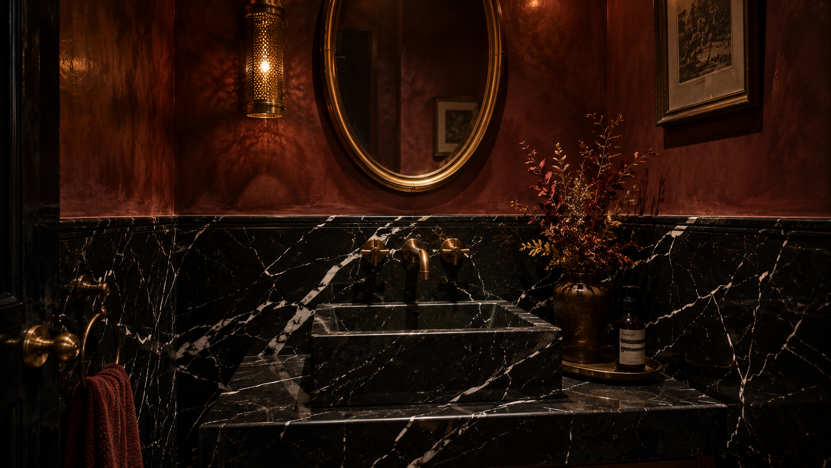 Dark stone powder room with black marble vessel sink — 2026 maximalist interior design