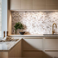 Stylish kitchen featuring a travertine mosaic backsplash and modern cabinetry, showcasing timeless natural stone elegance.
