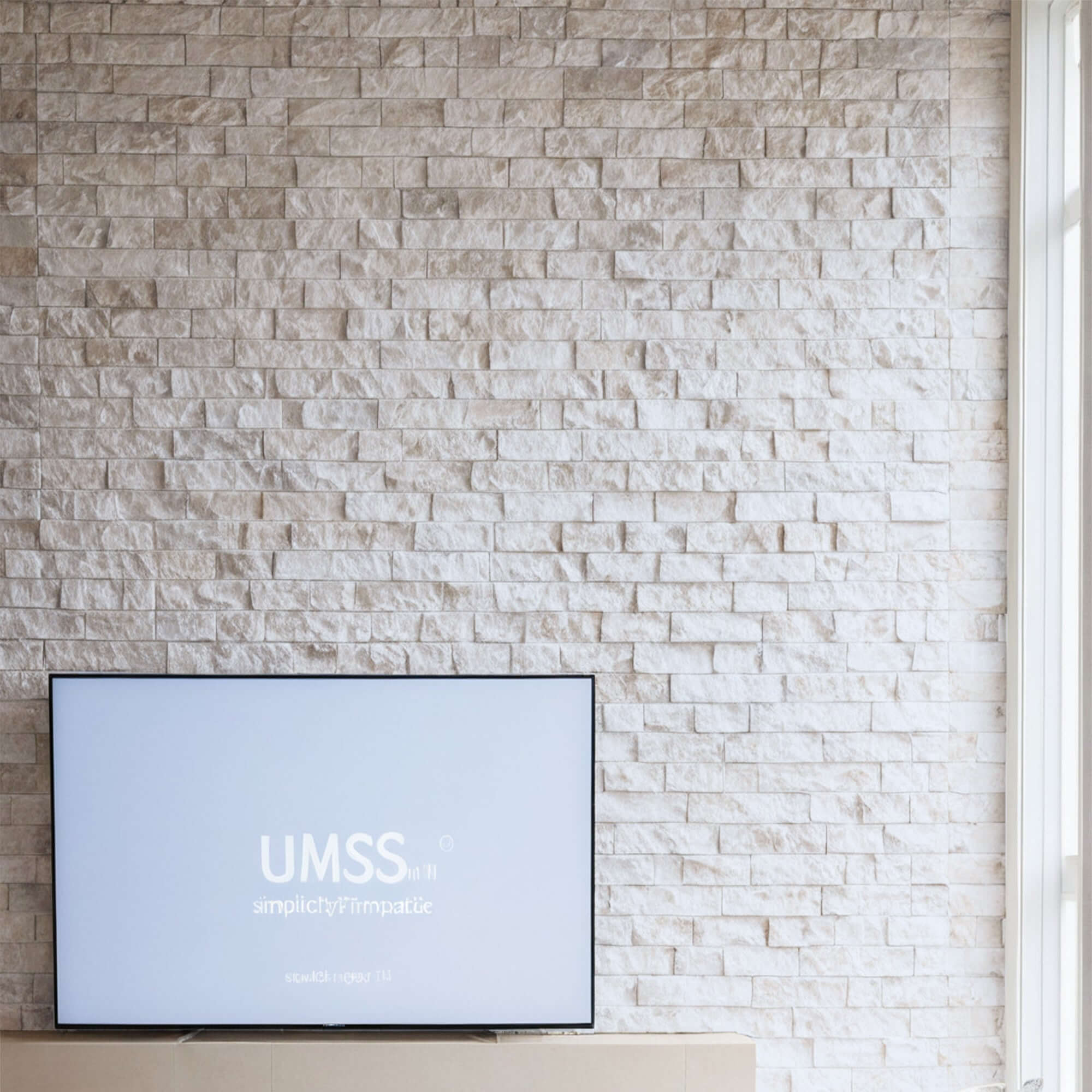 Limestone blasted mosaic wall with minimalist design and polished finish, enhancing contemporary living spaces.