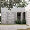 Contemporary building featuring natural stone walls, showcasing sleek minimalist design and quality craftsmanship.