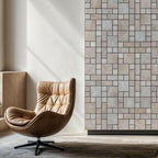 Blasted natural travertine pattern wall with a stylish leather chair, showcasing minimalist design and premium craftsmanship.