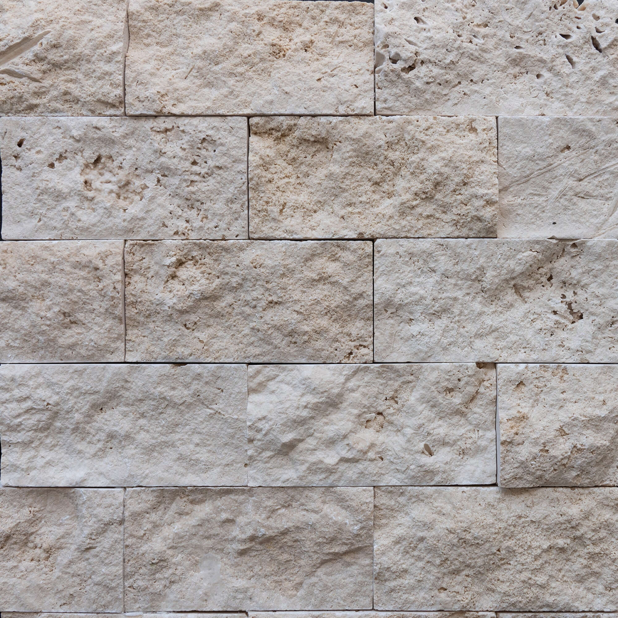 Light travertine blasted natural stone wall panels showcasing premium quality and timeless elegance for modern designs.