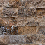 Blasted travertine stone wall tiles showcasing natural textures, perfect for elegant minimalist designs.