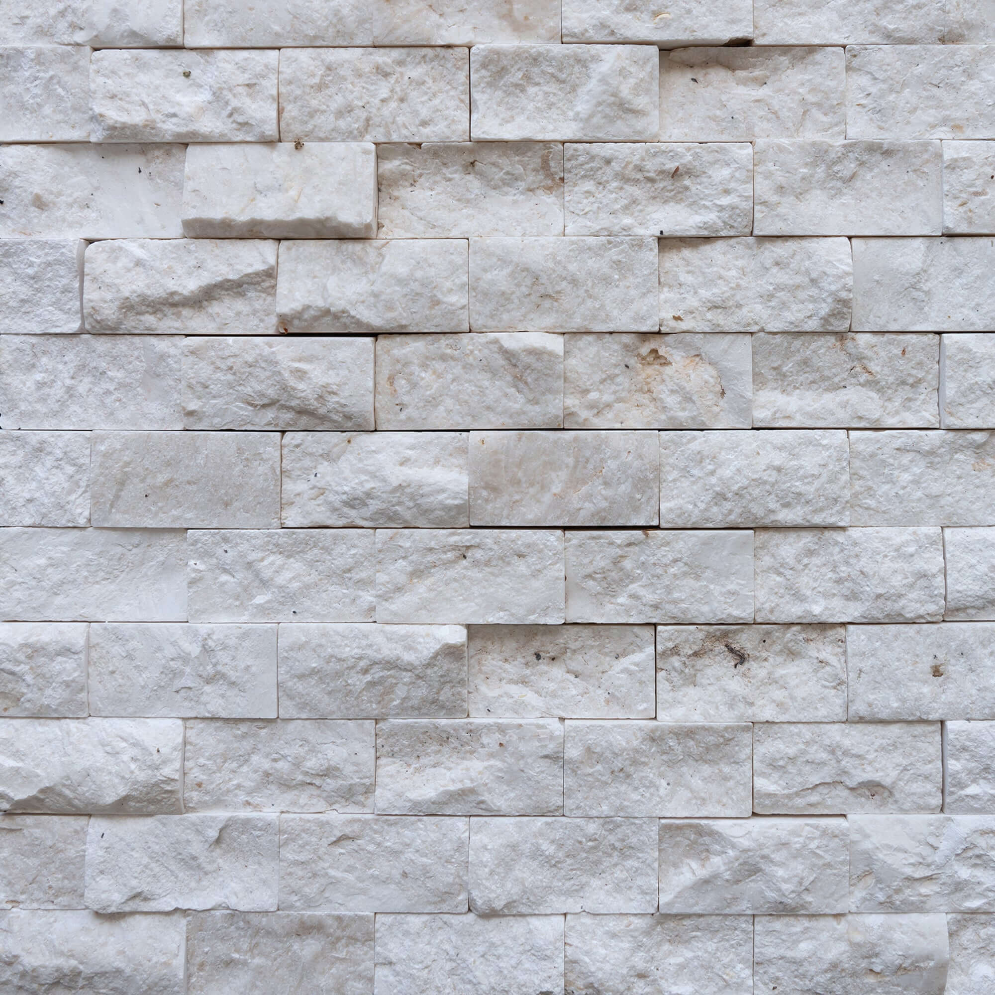 Blasted natural limestone mosaic showcasing elegant 3D texture, ideal for minimalist design and premium spaces.