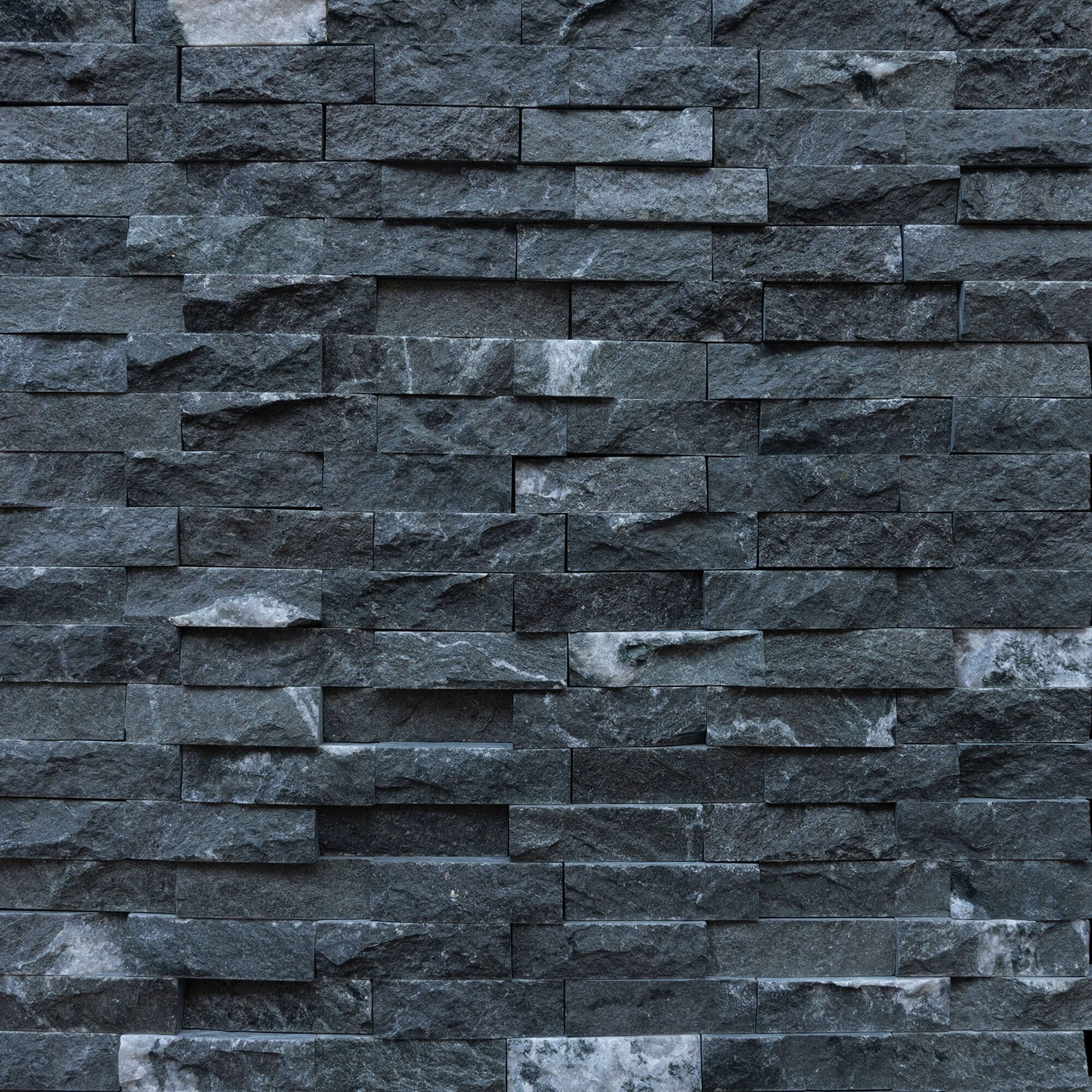 Black marble blasted mosaic wall, showcasing premium stone craftsmanship and minimalist design, ideal for elegant interiors.