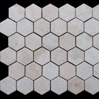 Beige marble hexagon tiles showcasing a polished finish and minimalist design, ideal for elegant spaces.