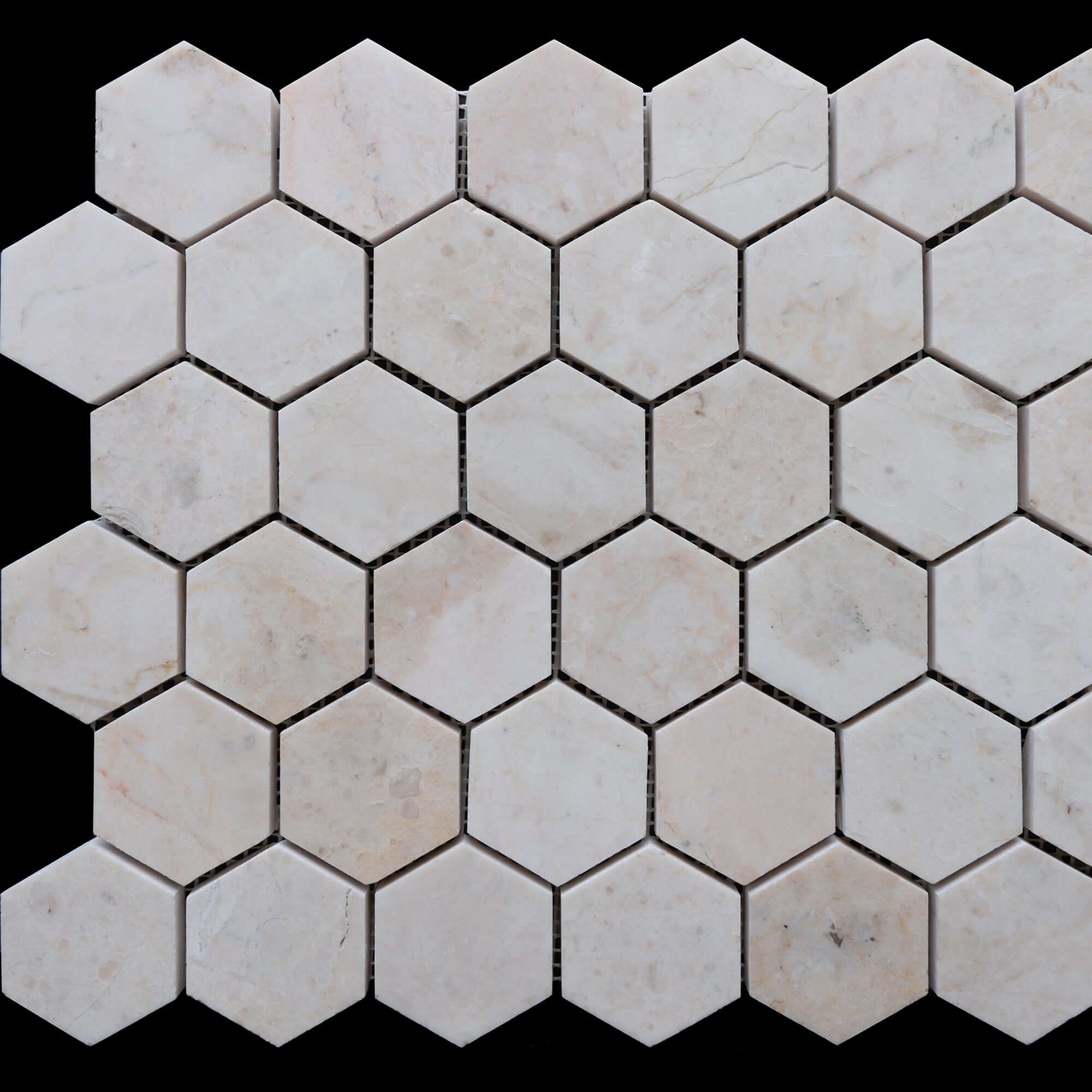 Beige marble hexagon tiles showcasing a polished finish and minimalist design, ideal for elegant spaces.